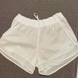 Athleta white lined running shorts.  Size medium